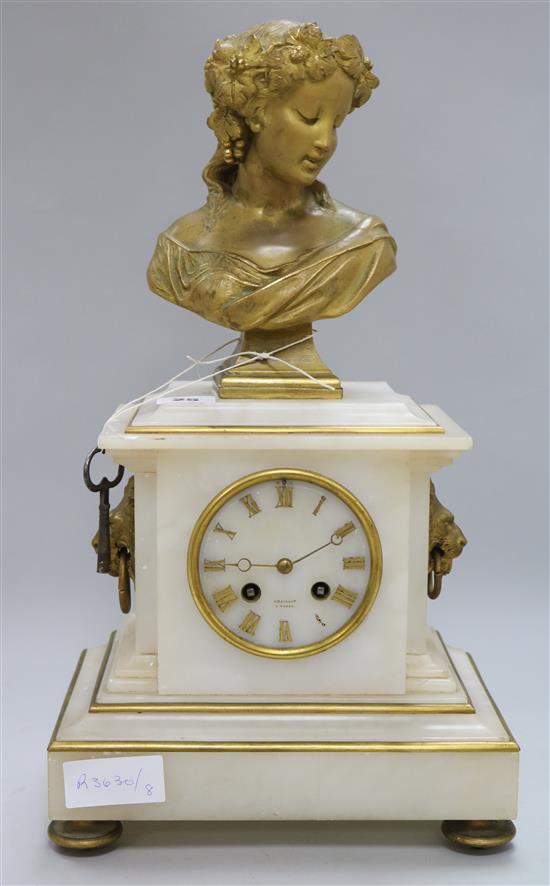 A white marble clock, with bronze bust surmount